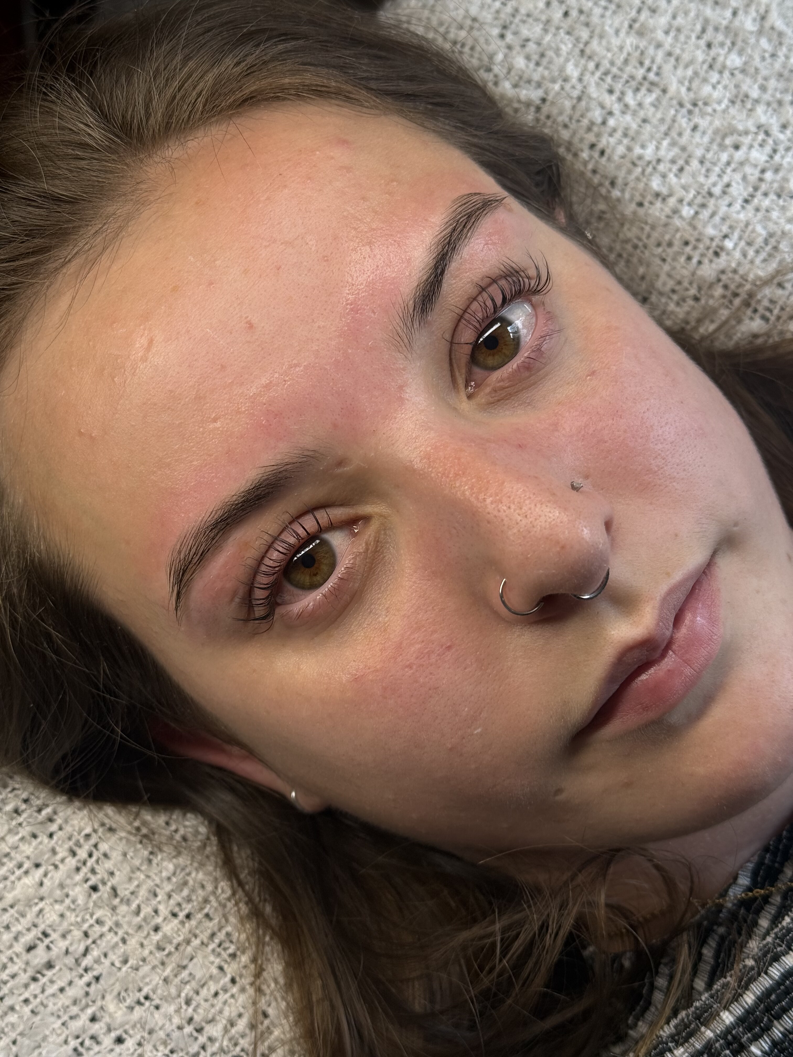 Lash lift and tint result on a client, soft natural curl close-up